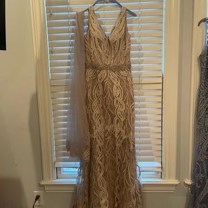 Mon Cheri intricate lace and beaded gown in champagne.